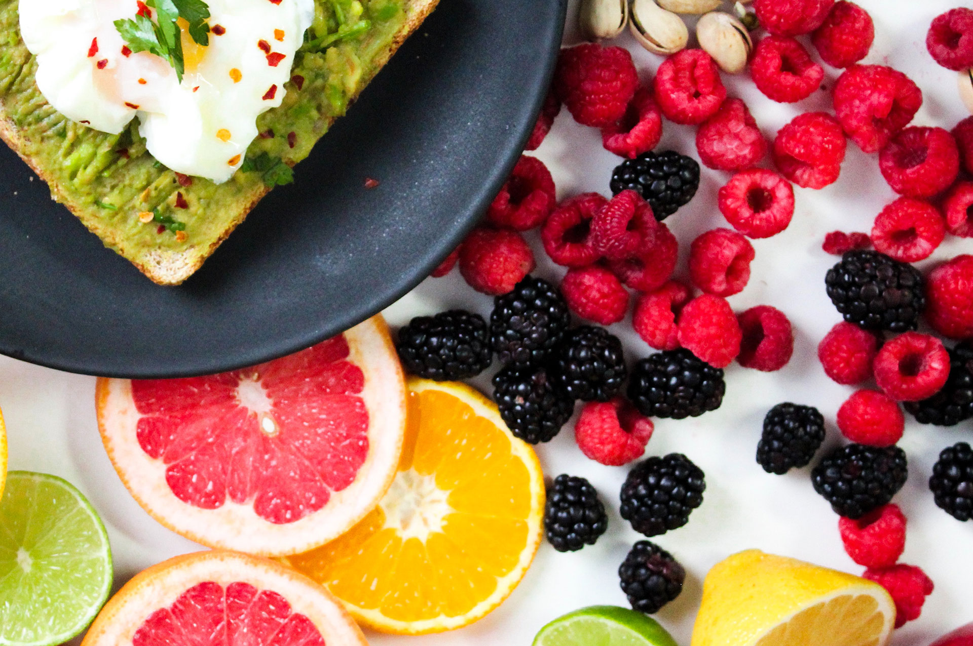 Healthy food with fruits and roast with a healthy spread and an egg
