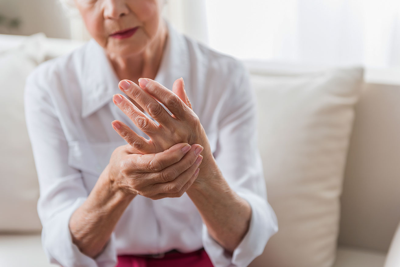 Older person with hand pain