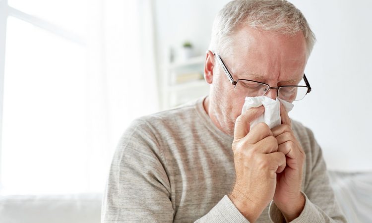 Elderly person having the flu