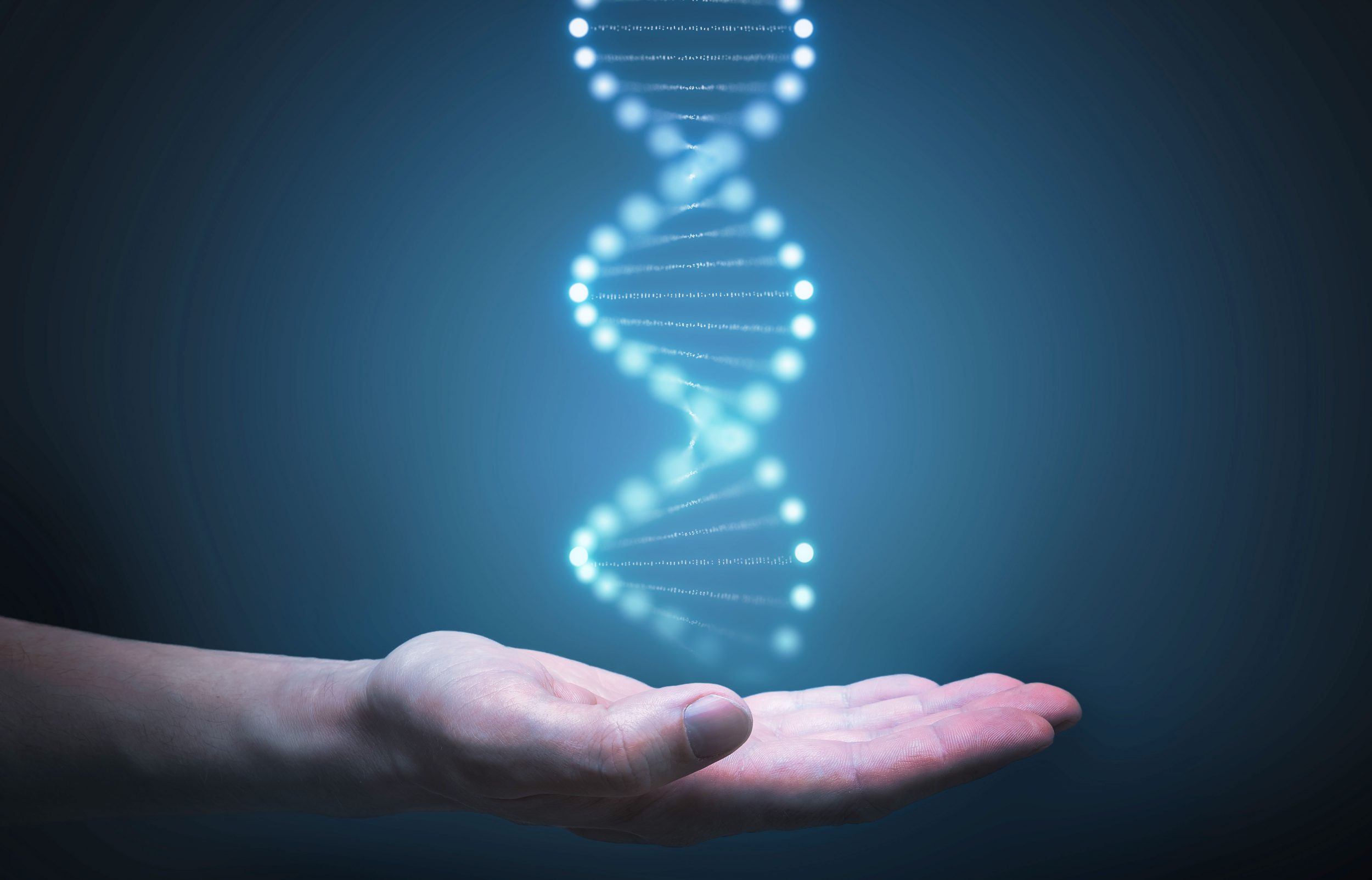 Hand outstretched with a DNA image in the hand